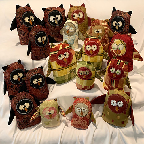 Stuffed owls made with remnants of fabric.